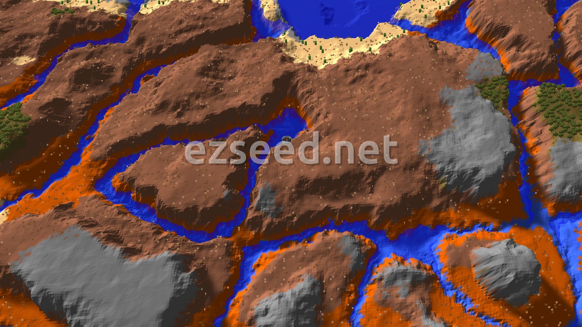 An overhead view of a mountainous landscape featuring a mix of orange and brown badlands, gray stony shores, and blue rivers and oceans. Scattered green trees are visible in some areas, with a small spawn marker in the center.